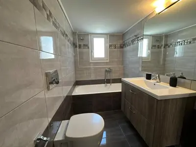 a bathroom with a toilet and a sink and a tub at Redamancy -- PERI009 in Athens