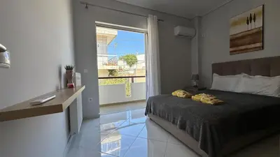 a bedroom with a bed and a large window at Redamancy -- PERI009 in Athens