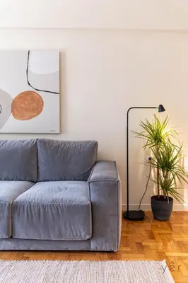 a living room with a couch and a lamp at Large 2Bedroom, 2Bathroom Flat with Dining Space & Free Parking in Athens