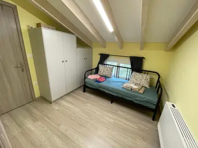 a small bedroom with a bed in a room at GS-Vibes in Porto Rafti