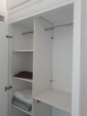 a white closet with glass doors and towels at Athens The View in Athens