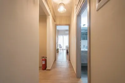 a hallway with a fire hydrant in a room at Stylish City Apartment by CloudKeys in Athens