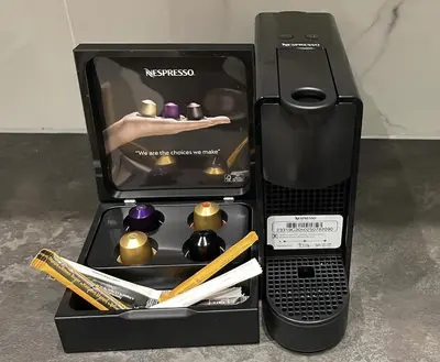 a black box with a cell phone and other items at Stylish City Apartment by CloudKeys in Athens