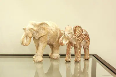 two figurines of an elephant and a zebra on a table at Modern and Luxury apartment in Athens