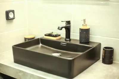a sink with a faucet in a bathroom at Modern and Luxury apartment in Athens