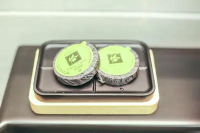 twocoins sitting on top of a cell phone at Modern and Luxury apartment in Athens