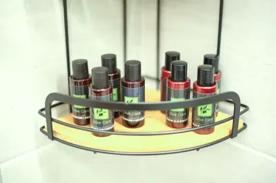 a shelf with a bunch of bottles of lipstick at Modern and Luxury apartment in Athens