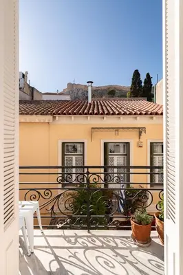 a view from a balcony of a house at Athenian Getaway Villa in Plaka with Acropolis View by Athenian Homes in Athens