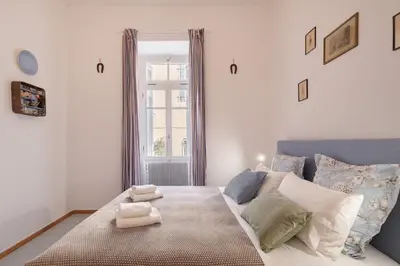 a bedroom with a large bed with towels on it at Athenian Getaway Villa in Plaka with Acropolis View by Athenian Homes in Athens