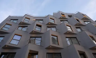 a building with windows on the side of it at Mitsis N'U Piraeus Port in Piraeus