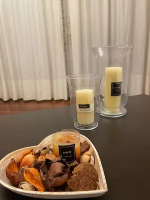 a plate of food with two candles on a table at DM Apartment 1 in Athens