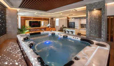 a jacuzzi tub in a hotel room at Zambelis Luxury Home Spa in Athens
