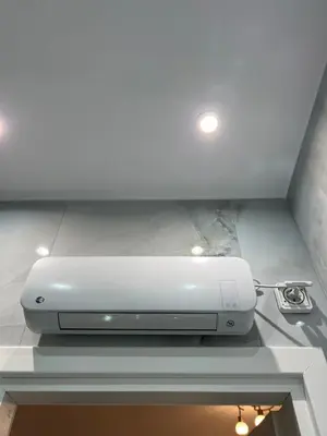 a dvd player sitting on a shelf in a ceiling at Selenity studio(close to two metro stations) in Piraeus
