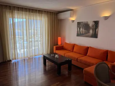a living room with a couch and a table at Machi's Apartment in Markopoulo