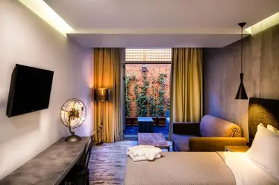 a hotel room with a bed and a couch at 360 Degrees in Athens