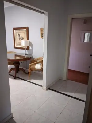 a room with a mirror and a table and a chair at Peaceful oasis in Athens