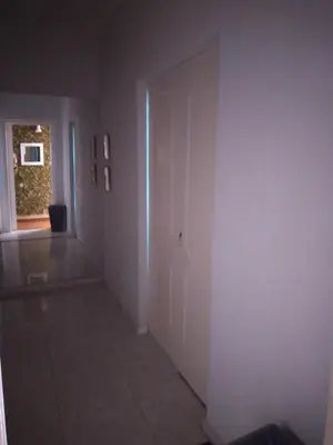 an empty hallway with a door in a room at Peaceful oasis in Athens