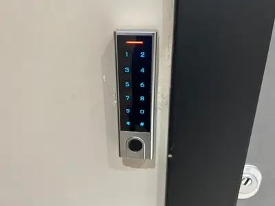 a door with a remote control on a wall at PORT TWINS SUITES No1 in Piraeus