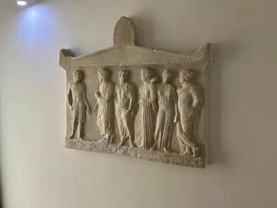 a relief of people hanging on a wall at PORT TWINS SUITES No1 in Piraeus