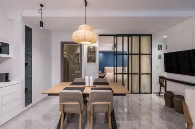 a kitchen and dining room with a table and chairs at Jun in Athens