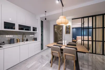 a kitchen and dining room with a table and chairs at Jun in Athens