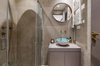 a bathroom with a sink and a shower at Jun in Athens