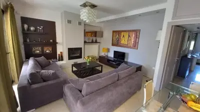 a living room with two couches and a table at The Beach House in Porto Rafti
