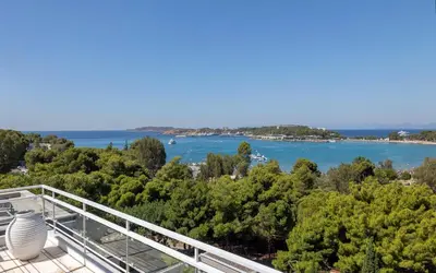 a view of the water from the balcony of a house at Luxury penthouse with stunning riviera view by GHH in Athens