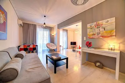 a living room with a couch and a table at Beautiful apartment in Glyfada center in Athens