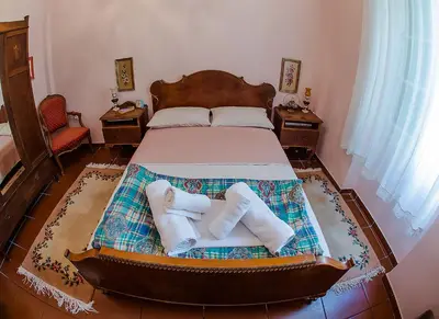 a bedroom with a bed with towels on it at Athens Quinta in Athens