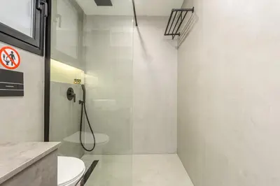 a bathroom with a shower and a toilet at The Oh Boy Studio in Athens in Athens
