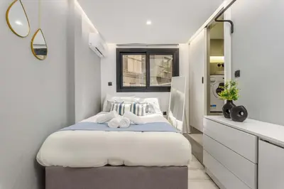 a small bedroom with a bed and a sink at The Oh Boy Studio in Athens in Athens