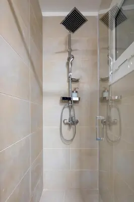 a shower with a glass door in a bathroom at Theia 1-Bedroom Apartment in Athens in Athens