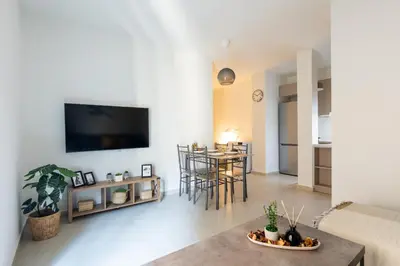 a living room with a couch and a table at Theia 1-Bedroom Apartment in Athens in Athens