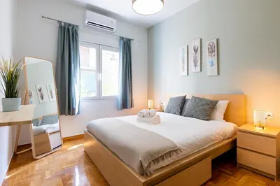 a bedroom with a large bed in a room at Astrea 1- Bedroom Apartment in Athens in Athens