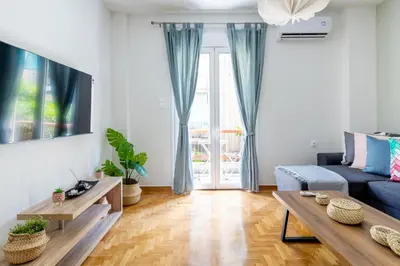 a living room with a couch and a table at Astrea 1- Bedroom Apartment in Athens in Athens