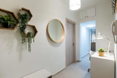 a bathroom with a sink and a mirror on the wall at Astrea 1- Bedroom Apartment in Athens in Athens