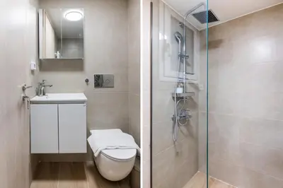 a bathroom with a shower and a toilet and a sink at Astrea 1- Bedroom Apartment in Athens in Athens
