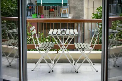 two chairs and a table on a balcony at Astrea 1- Bedroom Apartment in Athens in Athens