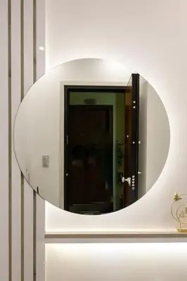 a circular mirror on a wall in a room at The Golden home 1 in Piraeus