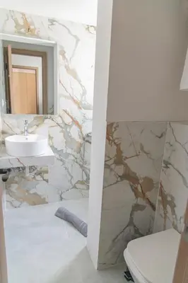 a bathroom with a sink and a mirror at Celia Residence in Athens
