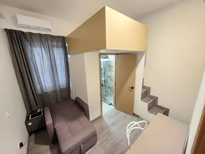 a small room with a staircase and a stair case at Celia Residence in Athens