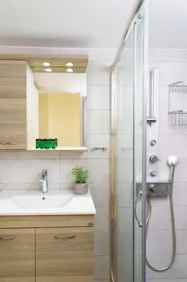 a bathroom with a sink and a shower at Sunset Escape & Spa in Athens