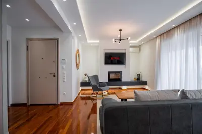 a living room with a couch and a table at Sesilia Luxury Apartments in Athens