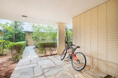 a bike parked on the side of a house at Private Garden Home next to the beach and market in Athens