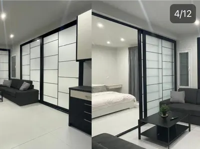 a bedroom with a bed and a couch in a room at George375 flat Park&Nat.Library&Opera/Onasseio/Rea in Athens