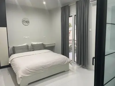 a white bedroom with a bed and a window at George375 flat Park&Nat.Library&Opera/Onasseio/Rea in Athens