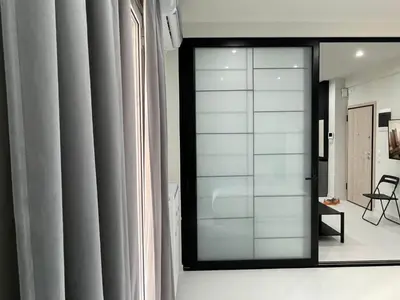 a mirror in front of a window in a room at George375 flat Park&Nat.Library&Opera/Onasseio/Rea in Athens