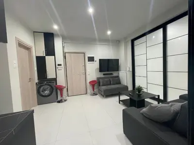 a living room with a couch and a living room with a tv at George375 flat Park&Nat.Library&Opera/Onasseio/Rea in Athens