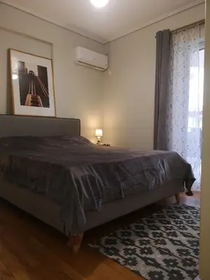 a bedroom with a bed and a window at Athenian Luxury apartment, near metro station Chalandri, Nu 1 in Athens